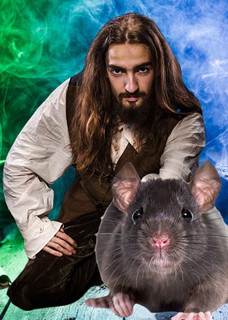 cover image for Epic fantasy serial The Forest of Bone shows a long-haired man guiding a rat